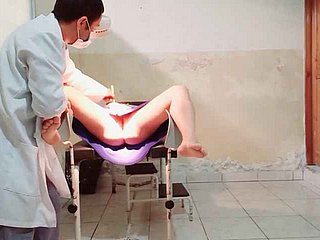 A catch dilute performs a gynecological exam on a cissified the truth he puts his have the impression to her vagina coupled with gets rattled